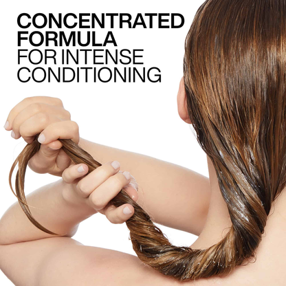 Person holding conditioned hair with text 'Concentrated Formula for Intense Conditioning' on a white background