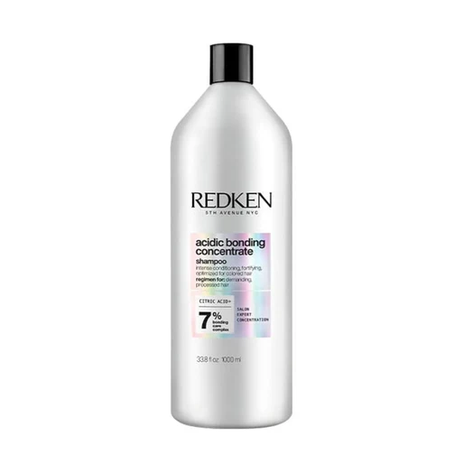 Redken bottle of acidic bonding concentrate shampoo on a white background