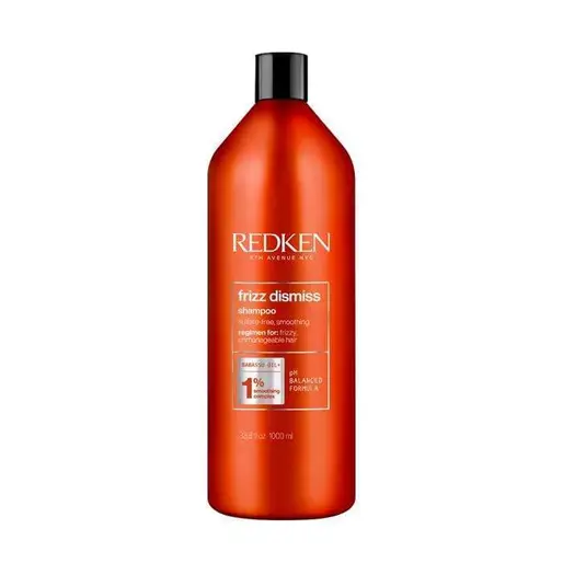 Redken frizz dismiss shampoo bottle on a white background