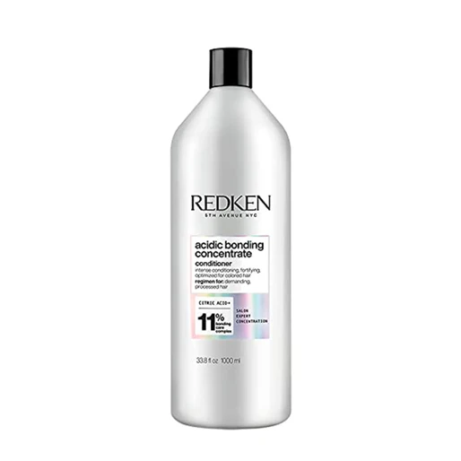 Redken bottle of acidic bonding concentrate conditioner on a white background