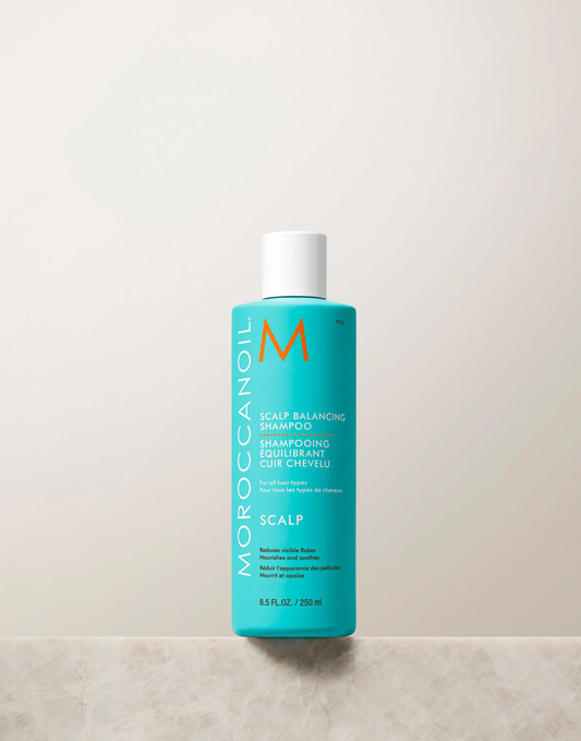 Moroccanoil shampoo bottle on a light gray background
