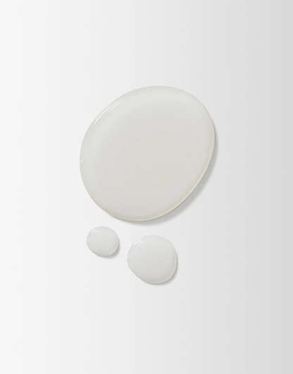 Set of three white ceramic plates on a light gray background