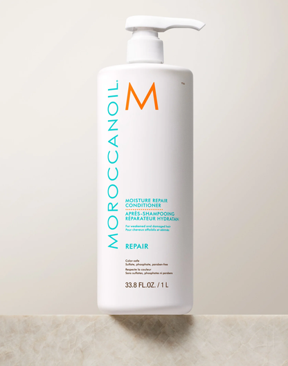 Moroccanoil Moisture Repair Conditioner bottle on a light background