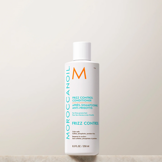Moroccanoil frizz control conditioner bottle on a light background