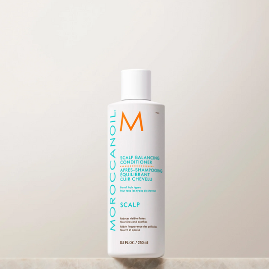 Moroccanoil scalp conditioner bottle on a light background