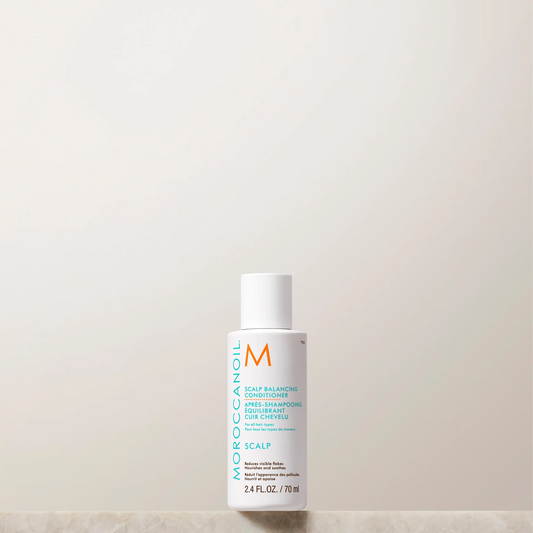 Moroccanoil scalp care product on a light background