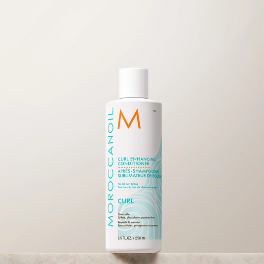 Moroccanoil Curl Enhance Conditioner bottle on a light background