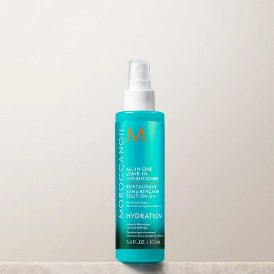 Moroccanoil bottle on a beige background