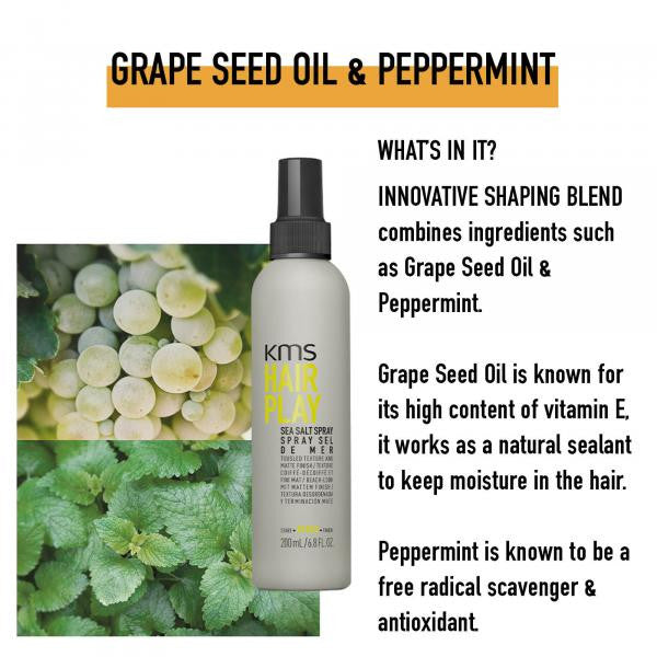 KMS Hair Play spray bottle with grape seed oil and peppermint text and images of grapes and peppermint leaves.