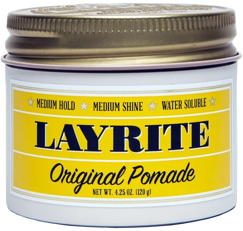 A white plastic jar of Layrite Original Pomade with a metallic gold screw-on lid and a yellow label featuring navy blue text.