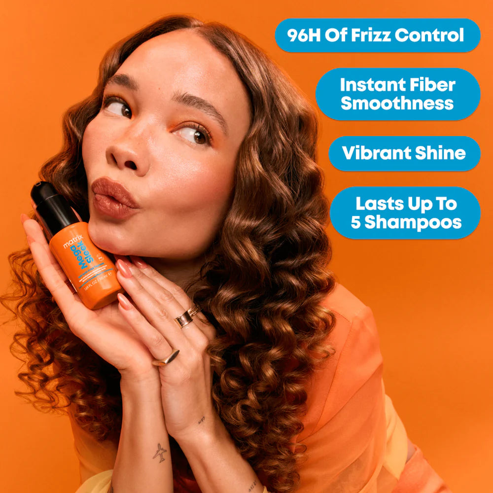 Woman holding a hair product with text on an orange background
