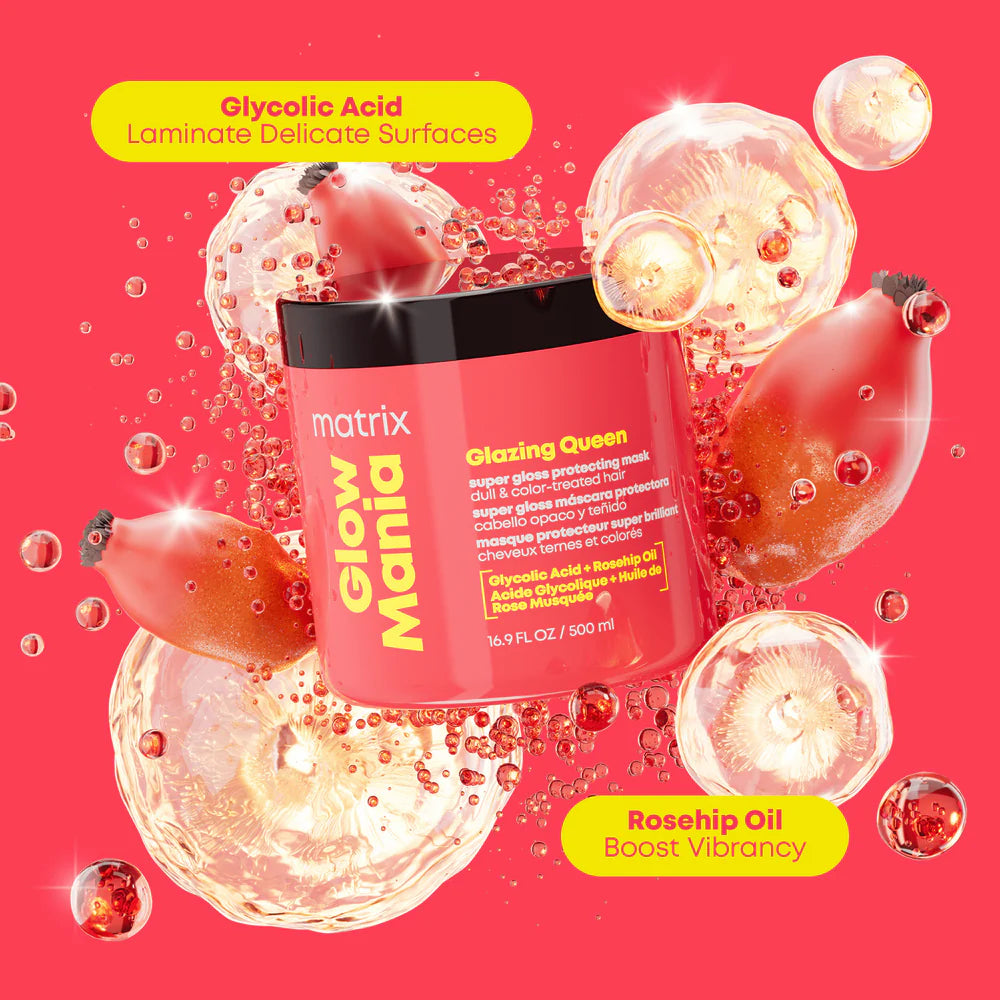 Matrix Glow Mania Glazing Queen hair mask bottle surrounded by rosehip oil droplets and pomegranate graphics on a bright pink background.