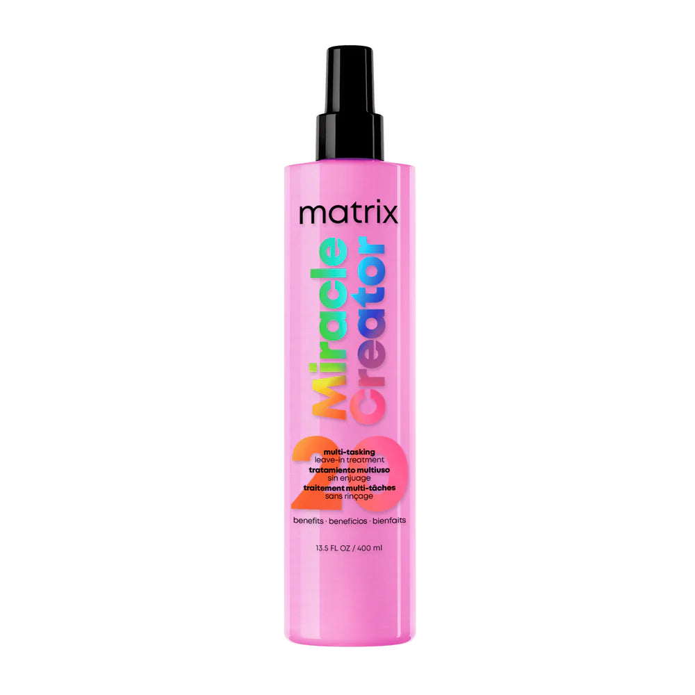 A pink bottle of Matrix Miracle Creator Multi-Tasking Hair Enhancer 400ml with a black spray nozzle, shown on a plain white background.