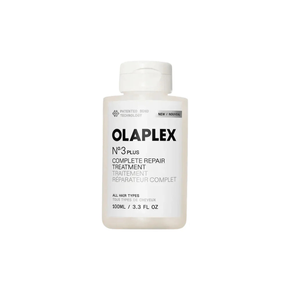 A white plastic bottle of Olaplex N°3 Plus Complete Repair Treatment with black text on a clean white background.