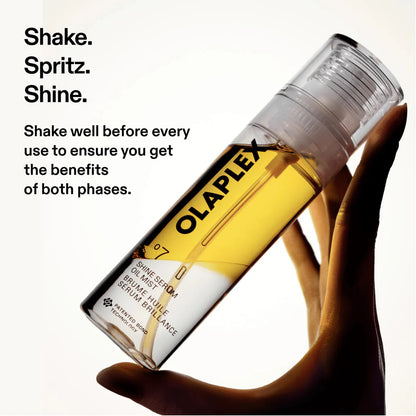 A hand holding a clear cylindrical bottle of Olaplex Skin Serum 07 with golden-yellow liquid inside, against a white background with black promotional text on the left.