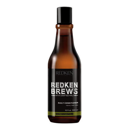 A 10 fl oz bottle of Redken Brews Daily Conditioner for all hair types, featuring an amber glass bottle, black cap, and a black label with white text.