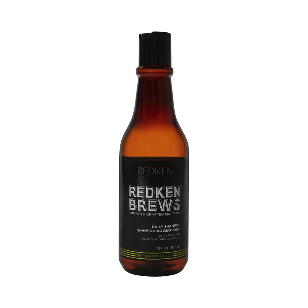 A 10 fl oz bottle of Redken Brews Daily Shampoo on a solid white background.