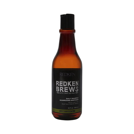 A 10 fl oz bottle of Redken Brews Daily Shampoo on a solid white background.