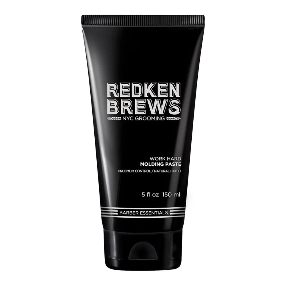 Black tube of Redken Brews molding paste on a white background