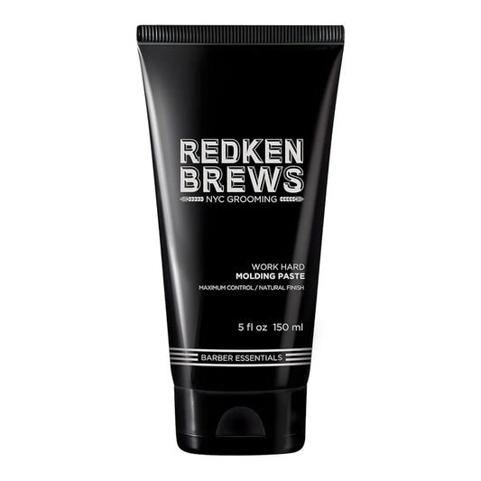 Black tube of Redken Brews molding paste on a white background