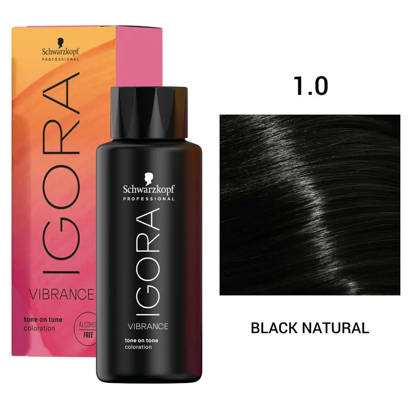 Schwarzkopf Professional Igora Vibration Coloration tone on tone developer bottle in Black Natural shade, shown with its pink-to-orange box and a hair swatch labeled 1.0 BLACK NATURAL.
