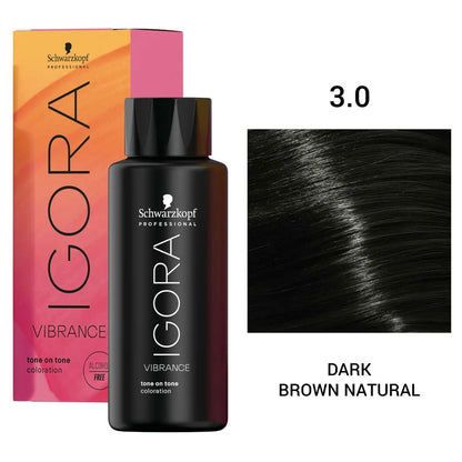 Schwarzkopf Professional Igora Vibrance tone on tone coloration bottle in shade 3.0 Dark Brown Natural, shown with its pink-to-orange gradient box and a hair swatch on a white background.